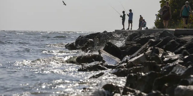 Fisherman are seen along the jetty at John's Pass Thursday, Feb. 23, 2023 in Madeira Beach, Fla.
