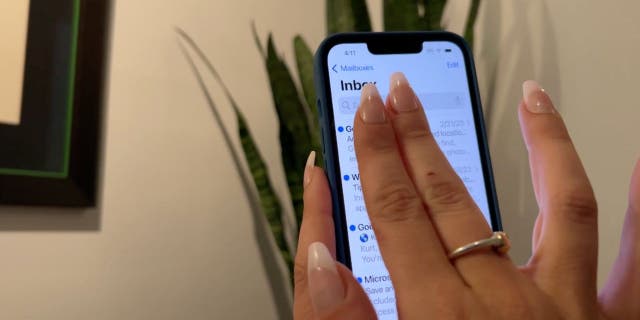 Swipe down quickly on your iPhone screen using your index and middle fingers.