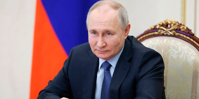 Russian President Vladimir Putin chairs a meeting on the social and economic development of Crimea and Sevastopol via video conference at the Moscow Kremlin in Moscow, Russia, Friday, March 17, 2023.