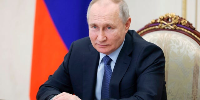 Russian President Vladimir Putin chairs a meeting on the social and economic development of Crimea and Sevastopol via a videoconference at the Moscow's Kremlin in Moscow, Russia, Friday, March 17, 2023.