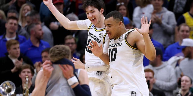 Jackson Francois, #12, and Nick Honor, #10 of the Missouri Tigers celebrate after defeating the Utah State Aggies in the first round of the NCAA Men's Basketball Tournament at the Golden 1 Center on March 16, 2023 in Sacramento, Calif.