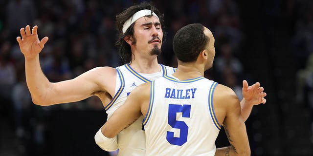 Amari Bailey #5 and Jaime Jaquez Jr. #24 of the UCLA Bruins react after a touchdown during the second half against the Northwestern Wildcats in the second round of the NCAA Men's Basketball Tournament at the Golden 1 Center on March 18, 2023, in Sacramento, United States.  California.
