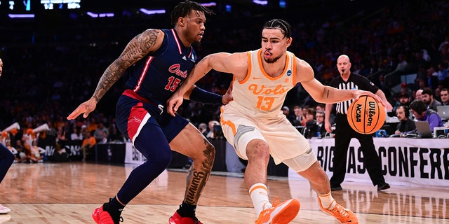Olivier Nkamhoua #13 of the Tennessee Volunteers is guarded by Alijah Martin #15 of the Florida Atlantic Owls during the first half of the game during the Sweet Sixteen round of the 2023 NCAA Men's Basketball Tournament held at Madison Square Garden on March 23, 2023 in New York City. 