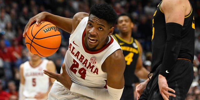 Alabama forward Brandon Miller drives into the lane during the second half of an NCAA college basketball game against Missouri in the semifinals of the Southeastern Conference Tournament, Saturday, March 11, 2023, in Nashville, Tennessee.