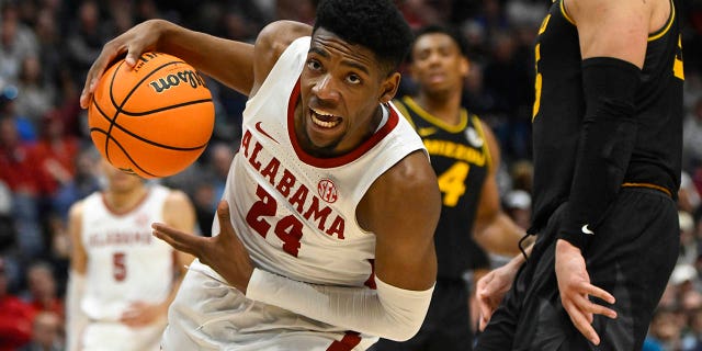 Alabama forward Brandon Miller drives into the lane during the second half of an NCAA college basketball game against Missouri in the semifinals of the Southeastern Conference Tournament, Saturday, March 11, 2023, in Nashville, Tennessee.