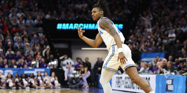 Dylan Andrews #2 of the UCLA Bruins reacts after a three point basket during the second half against the Northwestern Wildcats in the second round of the NCAA Men's Basketball Tournament at Golden 1 Center on March 18, 2023, in Sacramento, California. 