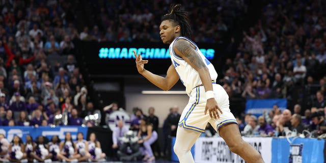 Dylan Andrews #2 of the UCLA Bruins reacts after a three point basket during the second half against the Northwestern Wildcats in the second round of the NCAA Men's Basketball Tournament at Golden 1 Center on March 18, 2023, in Sacramento, California. 