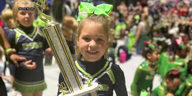 Peyton Thorsby smiles after winning cheer competition in Florida. 