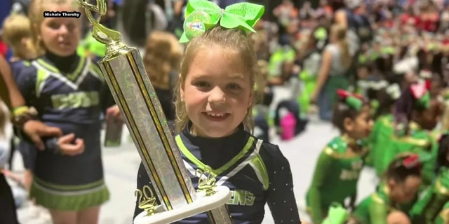 Peyton Thorsby smiles after winning cheer competition in Florida. 