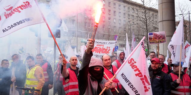 About 300 Polish coal miners angered by a European Union directive that cuts methane emissions protest loudly outside the EU office saying it will deprive them of work, in Warsaw, Poland March 24, 2023.