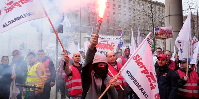 About 300 Polish coal miners angered by a European Union directive that cuts methane emissions protest loudly outside the EU office saying it will deprive them of work, in Warsaw, Poland March 24, 2023.