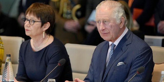 King Charles III is seen meeting with Turkish and Ukrainian staff during a visit to the European Bank for Reconstruction and Development on March 23, 2023, in London. The king will be in Germany on Wednesday.