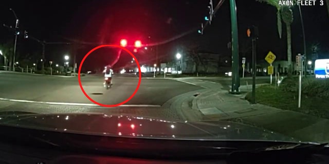 Joshua Richardson is seen flipping police officers off seconds before he was hit by a truck in an intersection.