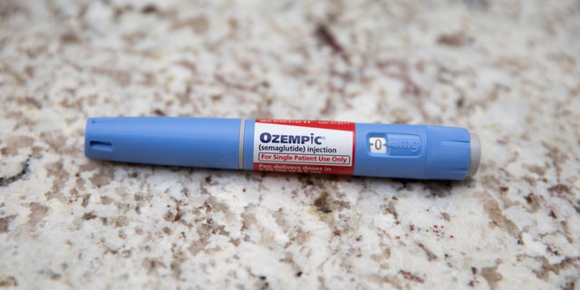 A photo illustration of an Ozempic pen seen sitting on a table in January 2023. The diabetes drug Ozempic has seen supply chain issues due to off-label prescribing for weight loss.