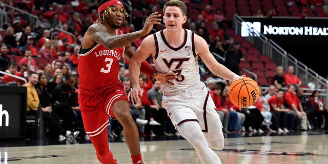 Virginia Tech guard Sean Pedulla (3) drives around Louisville guard El Ellis (3) during the half of an NCAA college basketball game in Louisville, Ky., Tuesday, Feb. 28, 2023.