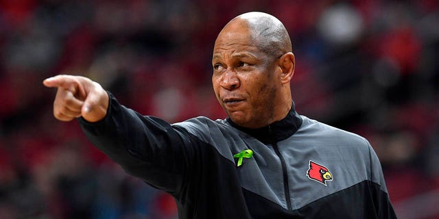 Louisville head coach Kenny Payne directs his team during the second half of an NCAA college basketball game against Virginia Tech in Louisville, Ky., Tuesday, Feb. 28, 2023. Virginia Tech won 71-54. 