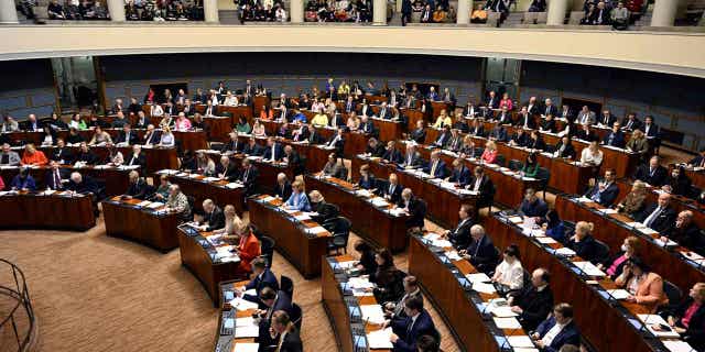 Parliament members attend the session where Finnish Parliament gave the country final approval to join NATO in Helsinki, Finland, on March 1, 2023.