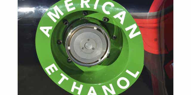 An American Ethanol label is shown on a NASCAR race car gas tank in Fort Worth, Texas, on Nov. 1, 2014. Gasoline with higher blends of ethanol may be sold year-round in eight Midwestern states beginning in 2024.