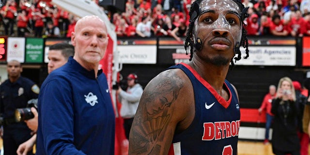 Detroit Mercy guard Antoine Davis, right, walks off the floor after his team was defeated by Youngstown State in an NCAA college basketball game in the quarterfinals of the Horizon League tournament Thursday, March 2, 2023, in Youngstown, Ohio.
