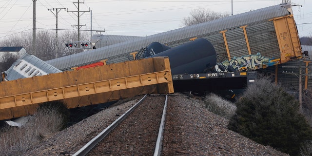 Multiple cars of a Norfolk Southern train lie toppled after derailing at a train crossing with Ohio 41 in Clark County, Ohio, March 4, 2023. 