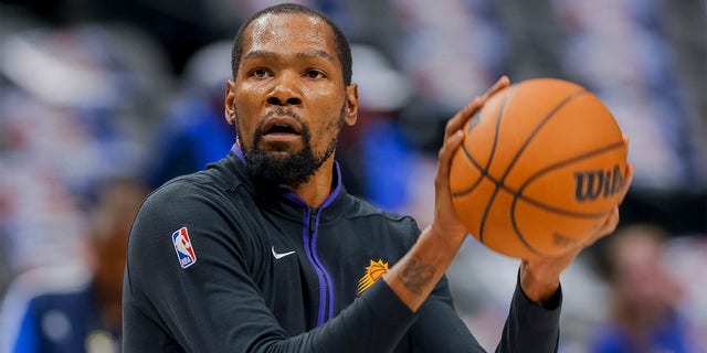Phoenix Suns forward Kevin Durant warms up before the Mavericks game, Sunday, March 5, 2023, in Dallas.