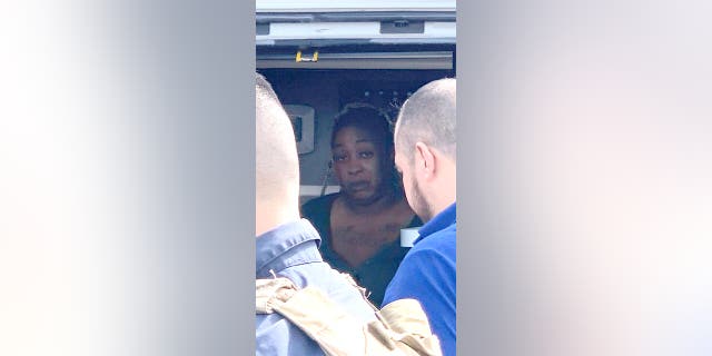 An American woman, abducted in Mexico then returned to the U.S., sits inside an ambulance after she was found alive in Ejido Longoreno, on the outskirts of Matamoros, Mexico, Tuesday, March 7, 2023.