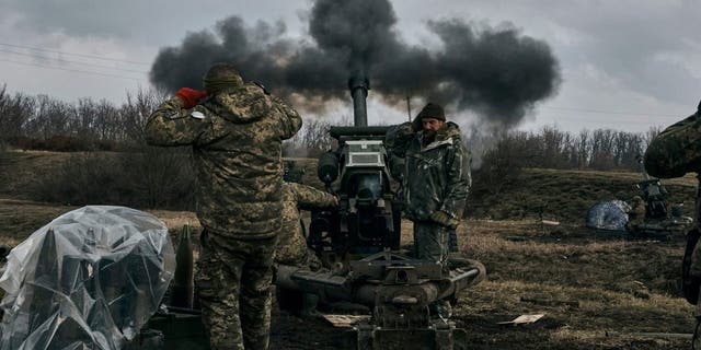 Ukrainian soldiers fire a self-propelled howitzer toward Russian positions near Bakhmut, the site of the heaviest battles in Ukraine's Donetsk region, Tuesday, March 7, 2023. 