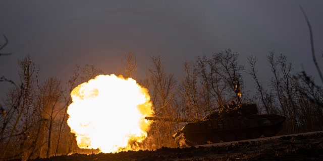 A Ukrainian tank fires on Russian positions at the front line near Bakhmut, Ukraine, March 8, 2023.