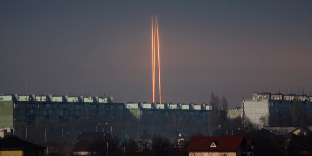 Three Russian rockets launched against Ukraine from Russia's Belgorod region are seen at dawn in Kharkiv, Ukraine, late Thursday, March 9, 2023. 