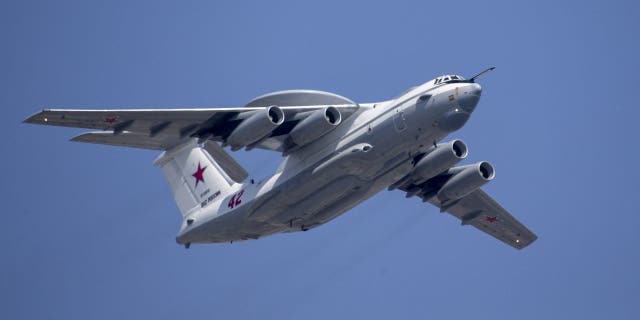 In this file photo from May 7, 2019, a Russian Beriev A-50 airborne early warning and control training aircraft flies over Red Square during a rehearsal for the Victory Day military parade in Moscow. 