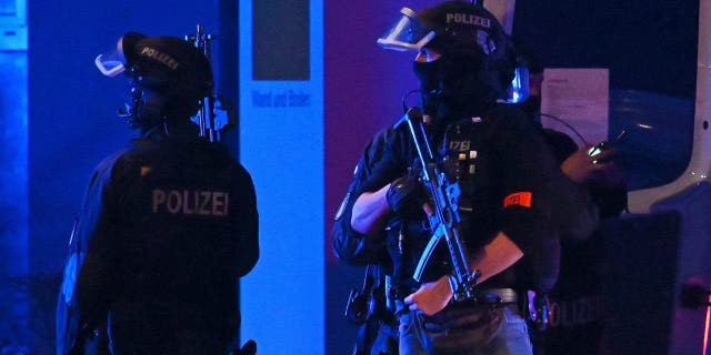 Armed police officers near the scene of a shooting in Hamburg, Germany on Thursday, March 9, 2023 after one or more people opened fire in a church. The Hamburg city government said the shooting took place in the Gross Borstel district.