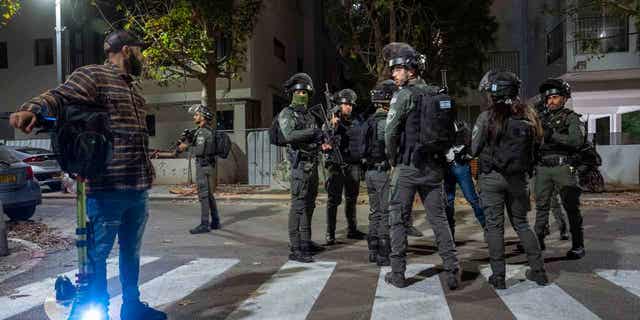 Israeli security forces search for a suspect in a gun attack in Tel Aviv, Israel March 9, 2023. Israeli police said a Palestinian gunman shot and wounded three people in central Tel Aviv before the attacker was shot to death. 