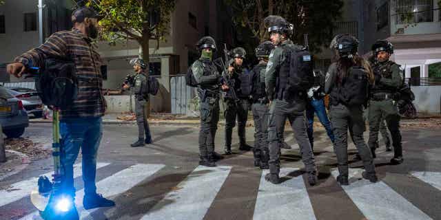 Israeli security forces search for a suspect in a gun attack in Tel Aviv, Israel March 9, 2023. Israeli police said a Palestinian gunman shot and wounded three people in central Tel Aviv before the attacker was shot to death. 