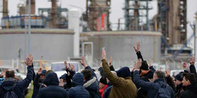 Oil workers vote to renew the strike at an oil refinery in France on March 10, 2023 in Paris.  French President Emmanuel Macron has insisted on the need for a pension reform in the country to make the system more sustainable for the future.     