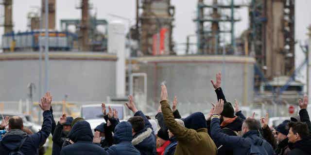 Oil workers vote to renew the strike at an oil refinery in France on March 10, 2023 in Paris.  French President Emmanuel Macron has insisted on the need for a pension reform in the country to make the system more sustainable for the future.     