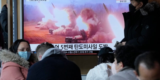 A TV screen shows an image of a North Korean missile launch during a news program at the Seoul Train Station in Seoul, South Korea on Tuesday, March 14, 2023. 