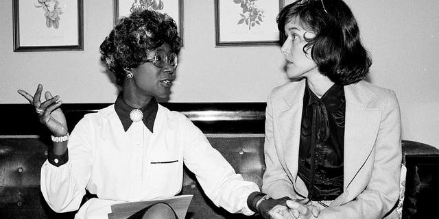 FILE - Congresswomen Shirley Chisholm, D-N.Y., left, and Pat Schroeder, D-Colo., are pictured at a news conference in Washington on July 31, 1979. 