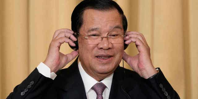 Cambodian Prime Minister Hun Sen attends a news conference at the Elysee Palace in Paris December 13, 2022. Two Cambodian activists were accused of insulting the king and prime minister on social media.