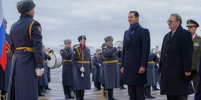 Syrian President Bashar Assad reviews an honor guard during a welcome ceremony in Moscow, Russia, Tuesday, March 14, 2023.