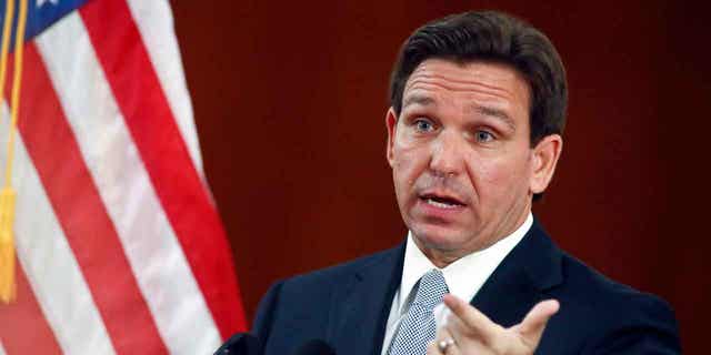 Florida Gov. Ron DeSantis answers questions from the media during a joint session of the Senate and House of Representatives, on March 7, 2023, at the state Capitol in Tallahassee, Florida. Texas and Florida lawmakers are debate strict legislation on border security.