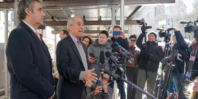 Michael Cohen, seen with his attorney Lanny Davis, said he wants former President Trump "held accountable for his own dirty deeds."