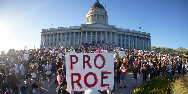 FILE - People attend an abortion-rights rally at the Utah State Capitol in Salt Lake City after the US Supreme Court overturned Roe v.  Wade, June 24, 2022. 