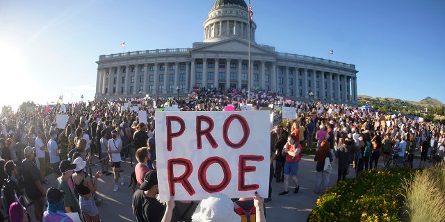 FILE - People attend an abortion-rights rally at the Utah State Capitol in Salt Lake City after the U.S. Supreme Court overturned Roe v. Wade, June 24, 2022. The decision by Utah’s Republican governor to approve legislation that bans abortion clinics is raising concerns about how already overburdened hospitals will accommodate becoming the only place for legal abortions in the state. 