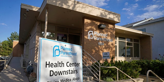 FILE - A sign is shown in front of Planned Parenthood of Utah Tuesday, June 28, 2022, in Salt Lake City. Utah Gov. Spencer Cox signed legislation on Wednesday, March 15, 2023, that will effectively ban clinics from providing abortions, setting off a rush of confusion among clinics, hospitals and prospective patients in the deeply Republican state. With the law set to start taking effect May 3, both the Planned Parenthood Association of Utah and the Utah Hospital Association declined to detail how the increasingly fraught legal landscape for abortion providers in Utah will affect their operations.
