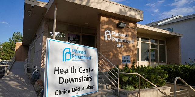 FILE - A sign is shown in front of Planned Parenthood of Utah Tuesday, June 28, 2022, in Salt Lake City. Utah Gov. Spencer Cox signed legislation on Wednesday, March 15, 2023, that will effectively ban clinics from providing abortions, setting off a rush of confusion among clinics, hospitals and prospective patients in the deeply Republican state. With the law set to start taking effect May 3, both the Planned Parenthood Association of Utah and the Utah Hospital Association declined to detail how the increasingly fraught legal landscape for abortion providers in Utah will affect their operations.