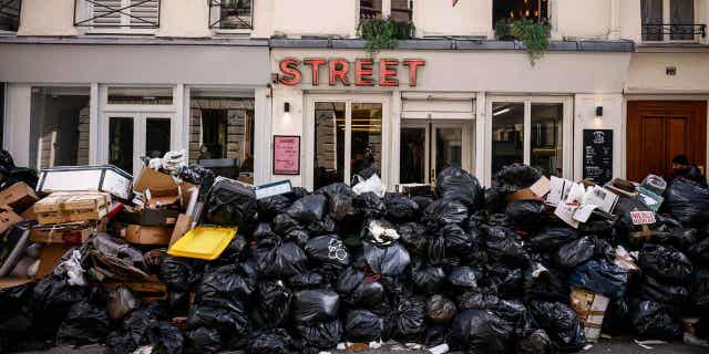 Uncollected garbage is piled up on a street in Paris, France, on March 15, 2023, as sanitation workers continue to strike.