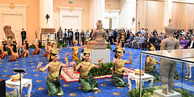 Dancers perform during a ceremony at Peace Palace, in Phnom Penh, Cambodia, on March 17, 2023. Artifacts that had been illegally smuggled out from Cambodia were welcomed home on Friday at a celebration led by Prime Minister Hun Sen.