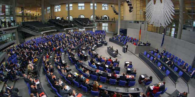 German Chancellor Olaf Scholz delivers a speech during a meeting of the Bundestag at the Reichstag building in Berlin, Germany, on Dec. 15, 2021. German lawmakers approved a reform of the country's voting system that would reduce the size of the parliament.