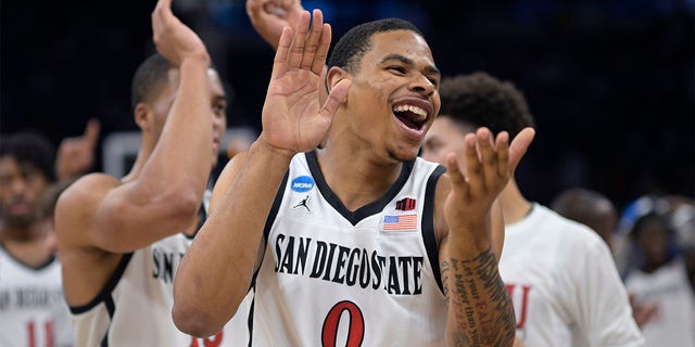 San Diego State forward Keshad Johnson (0) celebrates after their win against Furman in a second-round college basketball game in the NCAA Tournament, Saturday, March 18, 2023, in Orlando, Fla. 