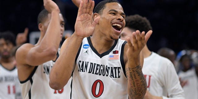 San Diego State forward Keshad Johnson (0) celebrates after their win against Furman in a second-round college basketball game in the NCAA Tournament, Saturday, March 18, 2023, in Orlando, Fla.